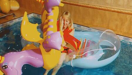 Alla blows away the magic dragon in an inflatable boat in the pool!!!