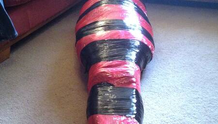 Mummification tight in pallet wrap escape challenge  mummified male bondage