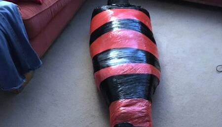 Mummified tight in pallet wrap escape challenge male bondage, mummification