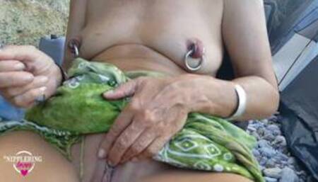 nippleringlover pierced nipples playing with pierced pussy at nude beach