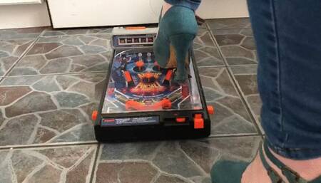 Pinball machine destroyed by high heels