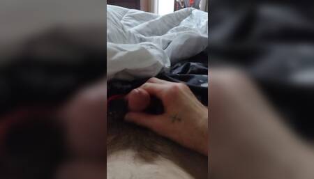 Stroking my cock.