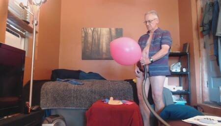 Jacking inside giant pink balloon then bursting it