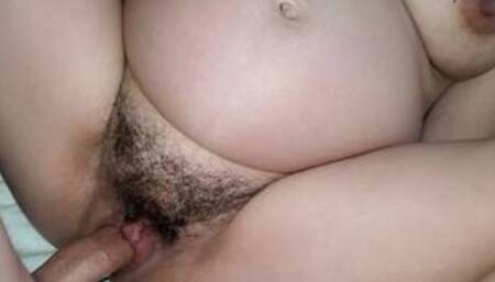 Close up of hairy pregnant pussy leaking cum around a big dick.