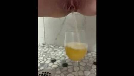 ASMR Sexy little pussy pissing into a wine glass.