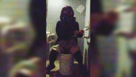 Crossdresser filmed herself peeing in a public restroom in the middle of the night.