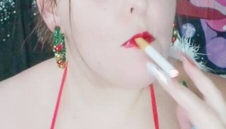 Nicki Pie smoking on red lingerie and black latex boots