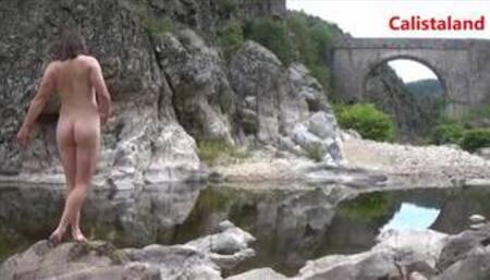 Young naked woman in a river