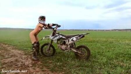 Naked woman riding a Dirt Bike