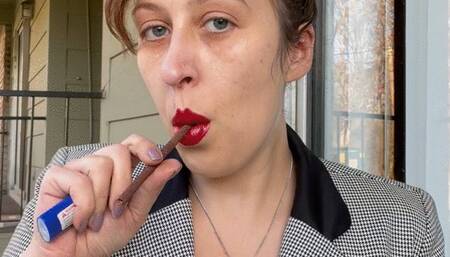 Goddess D Businesswoman with Hair Up Smoking More 120 in Coat and Red Lipstick