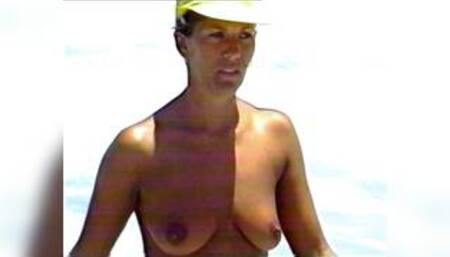 Tanned babe in the surf