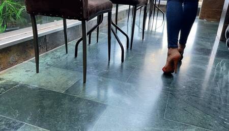 Milah Arches Sexy Dangling on Kiara Mules in Outdoor Cafe