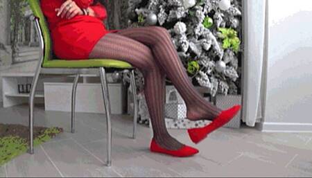 Dangling and toe tapping in red ballets flats a