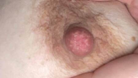 Rubbing cream on tits