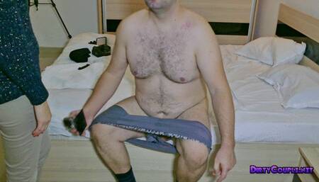 A seductive brunette is stomping on his cock and balls while wearing high heels