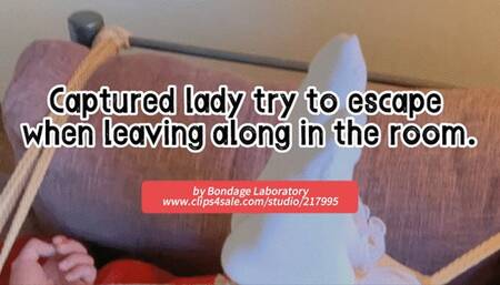 Captured lady try to escape when leaving along in the room