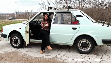 76 - Katya Skoda driving through city traffic