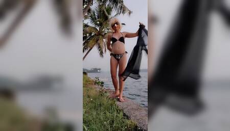 Undressing near Tropical river