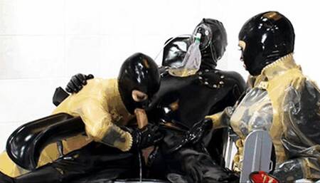 Threesome latex in clinic - Part 2 of 2 - Handjob while catheterised dick and piss