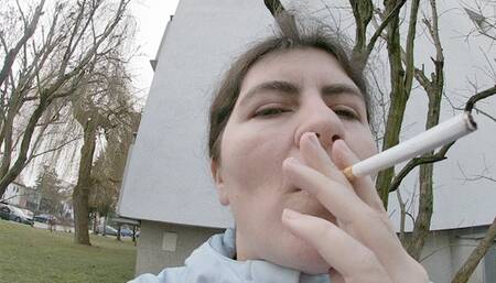 Smoking outside my place, into your face