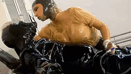 Latex clinic mistress, the rubber gas mask slave and the piss bladder catheter washout - Part 1 of 2