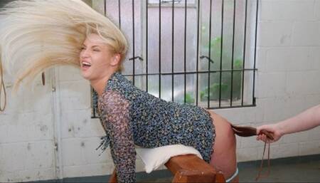 Strapped bare ass lying over a punishment frame: Essie Quinn feels leather