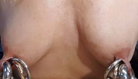 Nippleringlover horny milf stretching extreme nipple piercings by inserting multiple big rings in each nipple