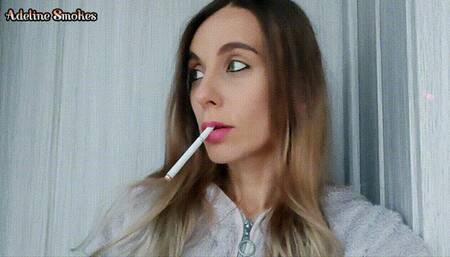 Smoking a cigarette close up to the camera