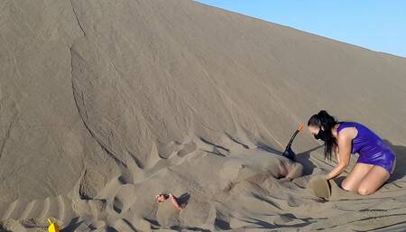 Latex girl buries slave under sand in desert