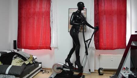 Jessi in black Latex Catsuit and Full Mask without Eyes  and 20cm Stripper Heels on Crosstrainer