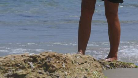 Walking on the beach with see through dress