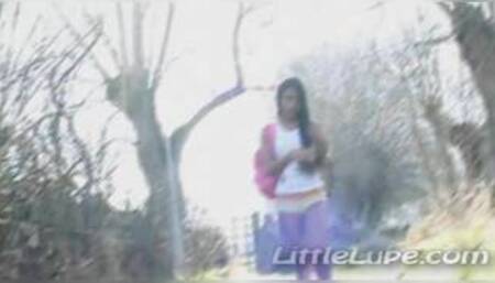 Petite latina masturbates under the sun