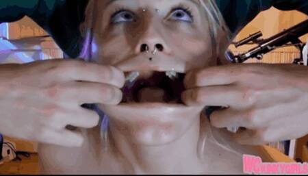 Sexy girl with clothespins on her nipples and her mouth fucked with dildo and hand