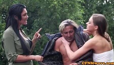 Femdoms jerking cfnm sub outdoors in group