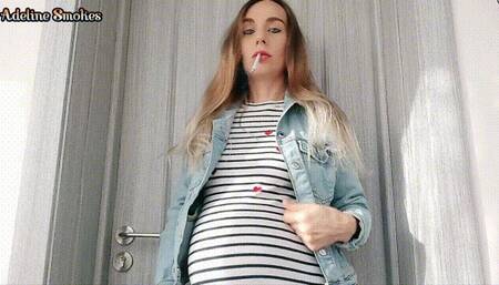 Smoking a cigarette in a denim jacket - pregnant 8 months