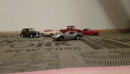 Model car crushed with socked feet