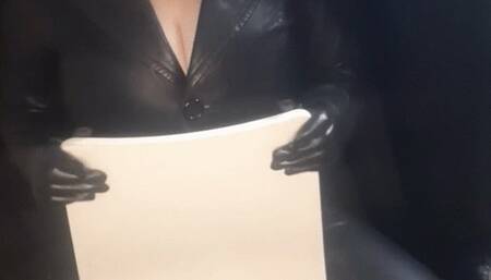 on a chair in leather pants, jacket and gloves, smoking for you