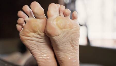 Girl washing calloused feet in the bathroom (1080p)