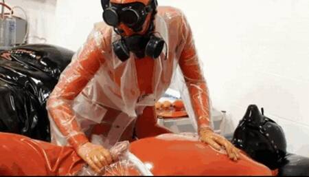 Heavy rubber, latex bodybag, gas mask and plastic fetish - Part 1 of 2 - The femdom handjob