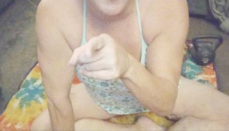 Mister watches Tempest film her arms and calves