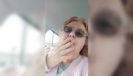 BBW smoking in pink sweater in her car talking to her fans