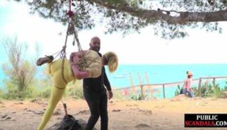 Public whore suspension bondage exposed with buttplug in ass