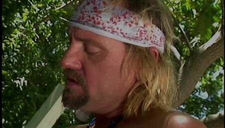 Blonde in black thigh-highs kneels to suck dude's cock outdoors