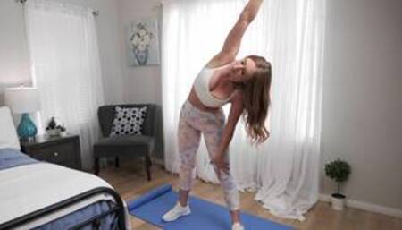 Skylar S and Harley K on a grey and white bed in a lesbian cheer squad scene together