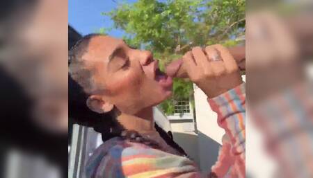 Ebony sucking long dong outdoors (OF)