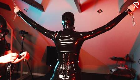 German Latex Slut is Bound and gagged and gets a spanking session
