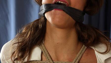 Cleavegagged topless barefoot Ekaterina, bound kneeling at the wooden post, wiggles helplessly (HD MP4)