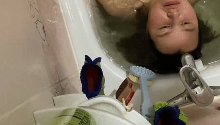 Diving in bathtub hholding breath