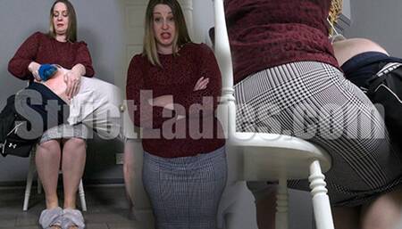 Over his stepmoms knee getting slippered