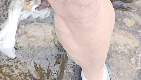 POV sneakers in creek